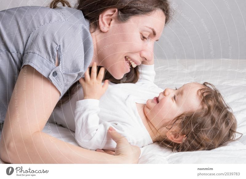 Baby girl playing with mother and have fun Joy Beautiful Playing Child Toddler Woman Adults Parents Mother Family & Relations Infancy Smiling Love Embrace