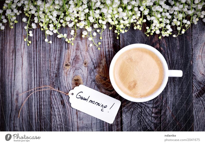 White cup with coffee on a gray wooden surface Breakfast Coffee Espresso Table Restaurant Flower Bouquet Wood Fresh Good Hot Above Retro Brown Café tag drink