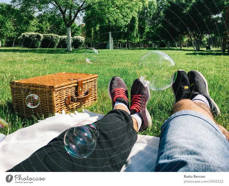 Romantic Couple Relaxing On Picnic Day In Spring Food Nutrition Eating Breakfast Lunch Lifestyle Joy Relaxation Leisure and hobbies Vacation & Travel Summer