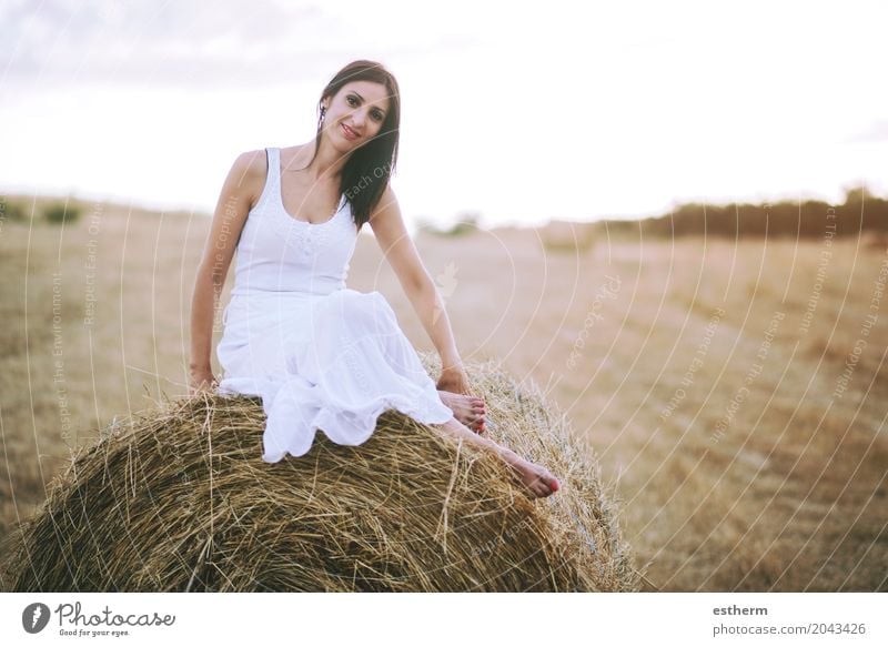 Smiling girl sitting on the straw Lifestyle Elegant Style Human being Feminine Young woman Youth (Young adults) Woman Adults 1 30 - 45 years Landscape Meadow