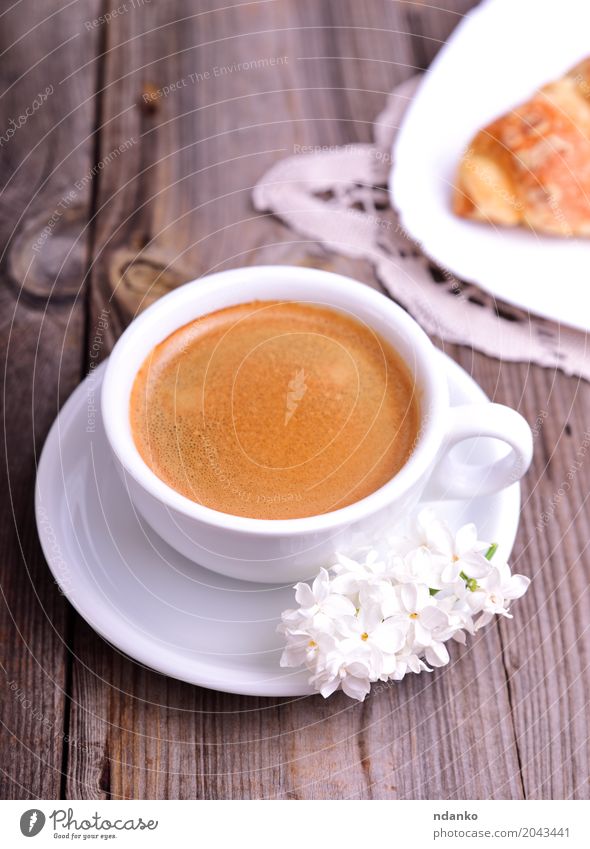 Black coffee in a white cup Croissant Dessert Breakfast Coffee Espresso Mug Table Restaurant Flower Bouquet Wood Eating Fresh Hot Above Retro Brown Gray White