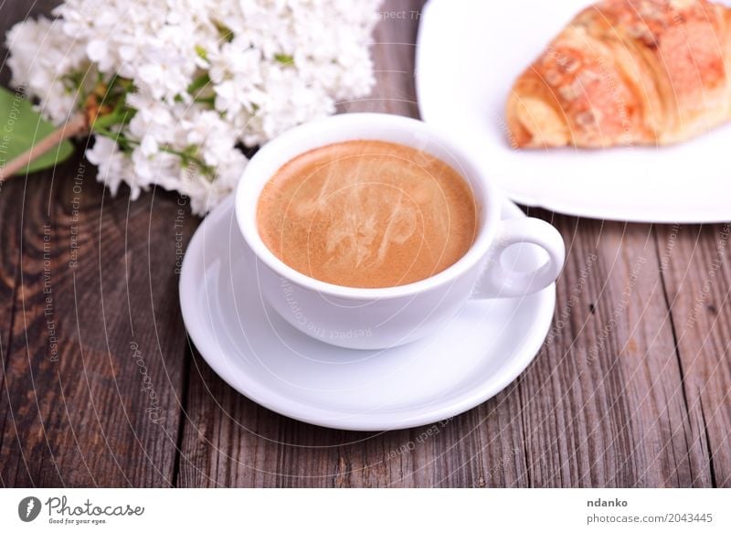 Cup of hot black coffee with croissant Croissant Breakfast Coffee Espresso Table Restaurant Flower Bouquet Wood Fresh Hot Delicious Above Retro Brown White Café