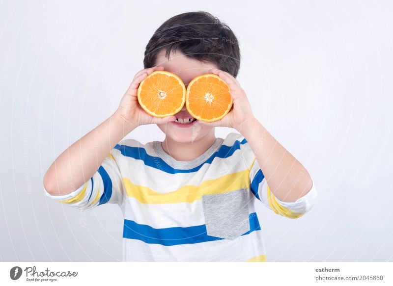 Funny boy with oranges Food Fruit Orange Nutrition Diet Lifestyle Joy Human being Child Toddler Boy (child) Infancy 1 3 - 8 years Feeding Smiling Laughter Fresh