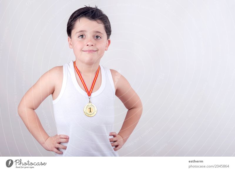 Happy little boy with golden medal Lifestyle Joy Playing Sports Fitness Sports Training Sportsperson Success Education Child Human being Toddler Boy (child) 1