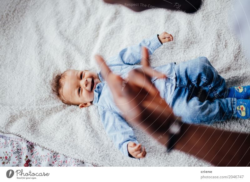 Happy Toddler boy playing with his dad on bed Lifestyle Joy Playing Masculine Baby Boy (child) Father Adults Family & Relations Smiling Small Cute Emotions