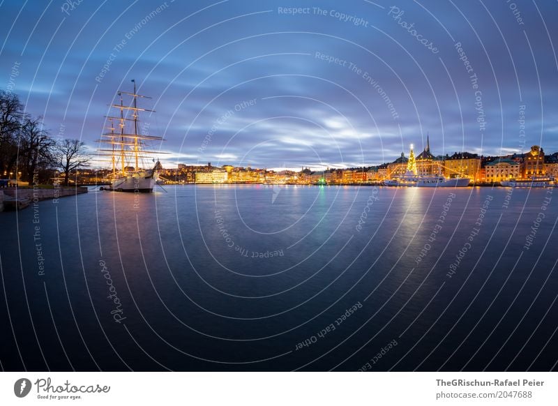 Stockholm by Night Capital city Port City Blue Yellow Gold Violet White Town Dusk Tree Christmas tree Light Ocean Reflection Sailing ship Watercraft