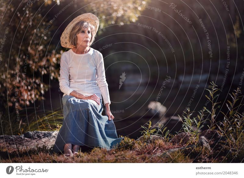 Senior woman sitting in the field Lifestyle Elegant Beautiful Wellness Relaxation Human being Feminine Woman Adults Female senior Mother Grandparents