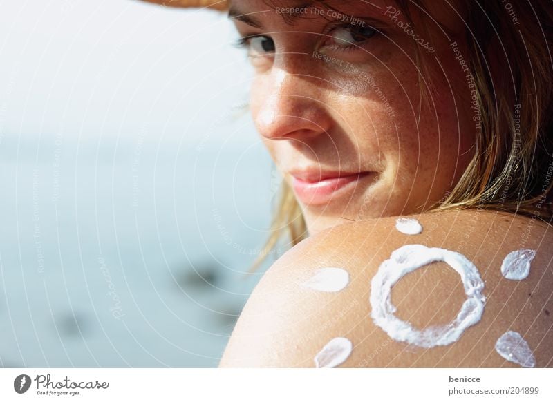 sun cream Suntan lotion Weather protection sunblock Woman Human being Sunbathing Symbols and metaphors Sign Painted Looking into the camera Attractive Skin
