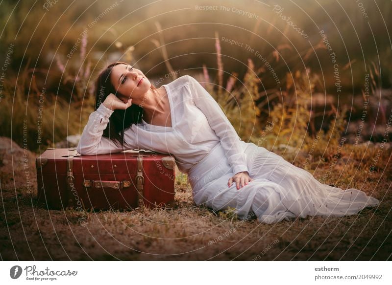 Woman sitting in the field with suitcase Lifestyle Elegant Style Beautiful Wellness Vacation & Travel Tourism Trip Adventure Freedom Human being Feminine