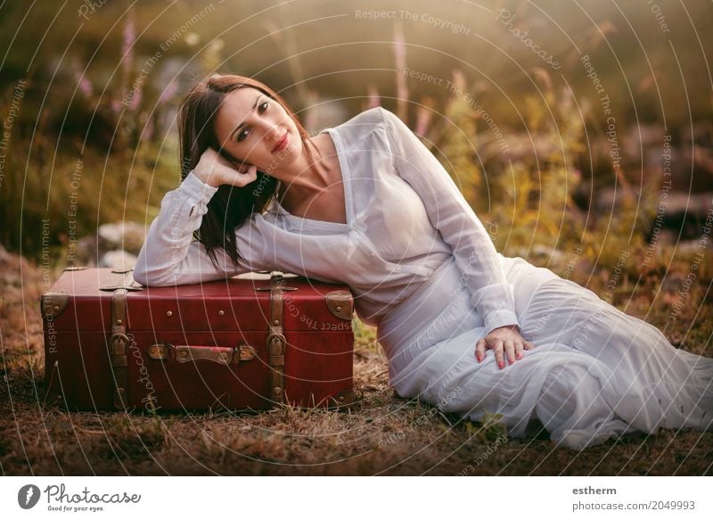 Woman sitting in the field with suitcase Lifestyle Joy Beautiful Wellness Relaxation Vacation & Travel Trip Adventure Human being Feminine Young woman