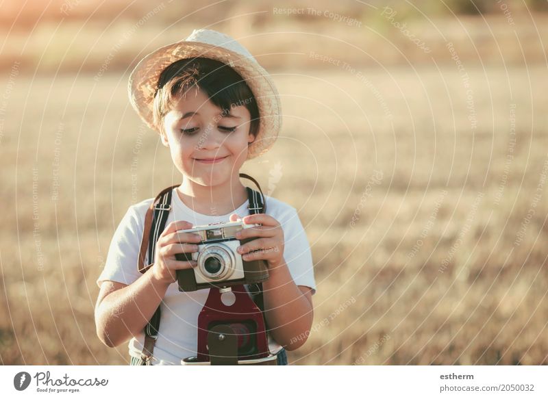 Happy boy with camera Lifestyle Joy Vacation & Travel Trip Adventure Freedom Camera Human being Masculine Child Toddler Boy (child) Infancy 1 3 - 8 years Meadow