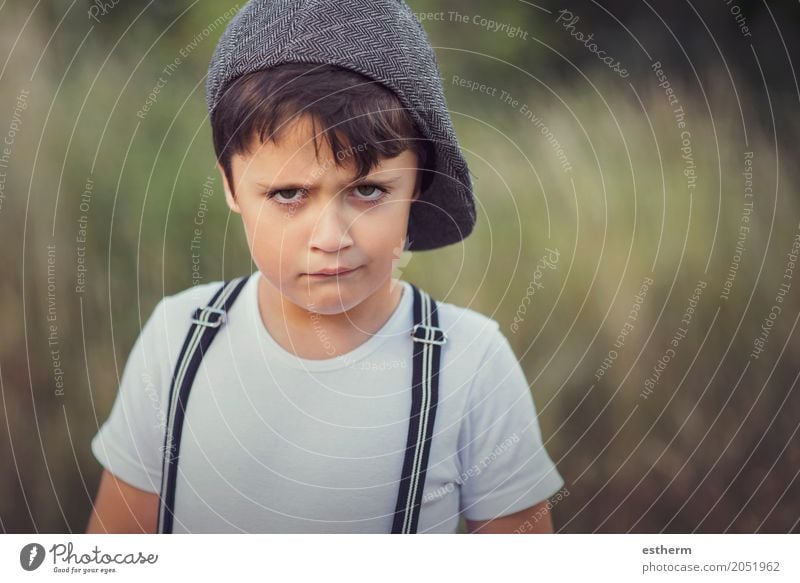 closeup of angry little boy with hat Lifestyle Human being Masculine Child Toddler Boy (child) Infancy 1 3 - 8 years Garden Park Cap Sadness Rebellious Emotions