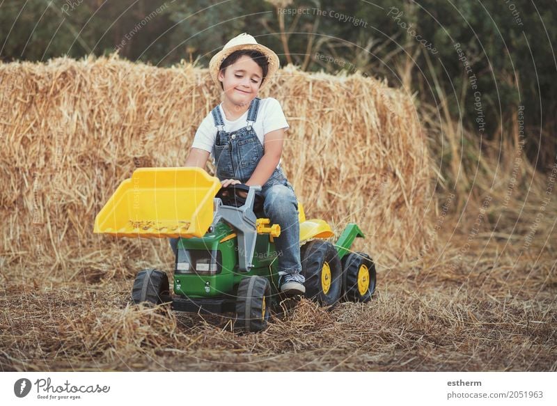 Child playing with toy tractor on meadow Lifestyle Playing Children's game Garden Gardening Agriculture Forestry Human being Toddler Boy (child) Infancy 1