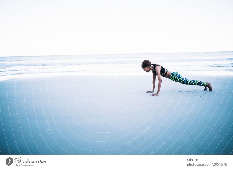 Fit young adult african women doing yoga on beach - a Royalty Free Stock  Photo from Photocase