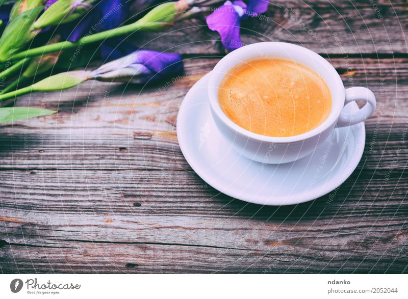 cup of coffee on a gray wooden surface Breakfast Beverage Coffee Espresso Table Restaurant Flower Bouquet Wood Fresh Hot Above Retro Brown White Iris Purple