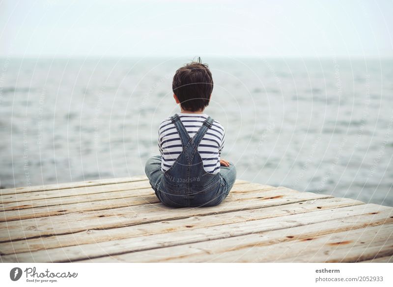 Thoughtful child sit at waterfront. Back view Lifestyle Human being Child Toddler Boy (child) 1 3 - 8 years Infancy Fitness Vacation & Travel Dream Sadness