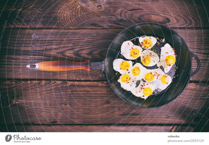Fried quail eggs Meat Herbs and spices Eating Breakfast Pan Kitchen Natural Above Retro Brown Yellow Egg Yolk Protein frying pan Frying food cook vintage Top