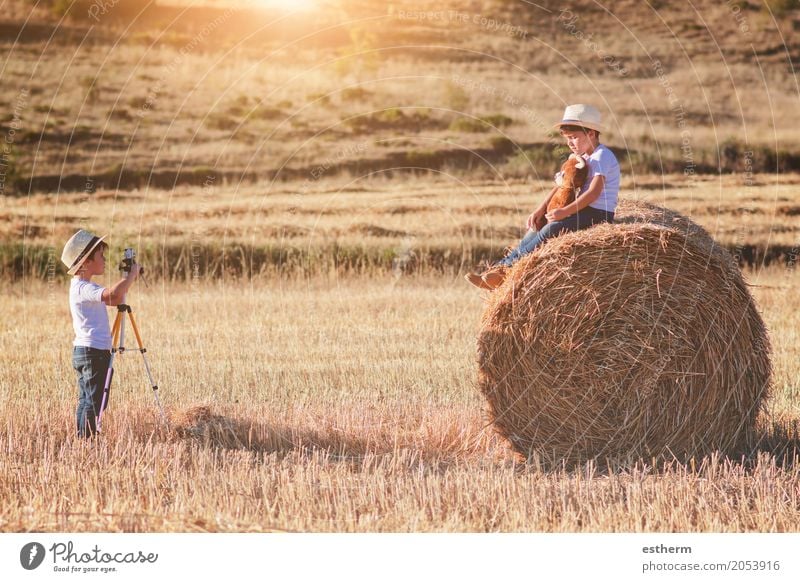 Brothers playing in the field.Children take pictures in the straw field Lifestyle Leisure and hobbies Children's game Vacation & Travel Tourism Adventure