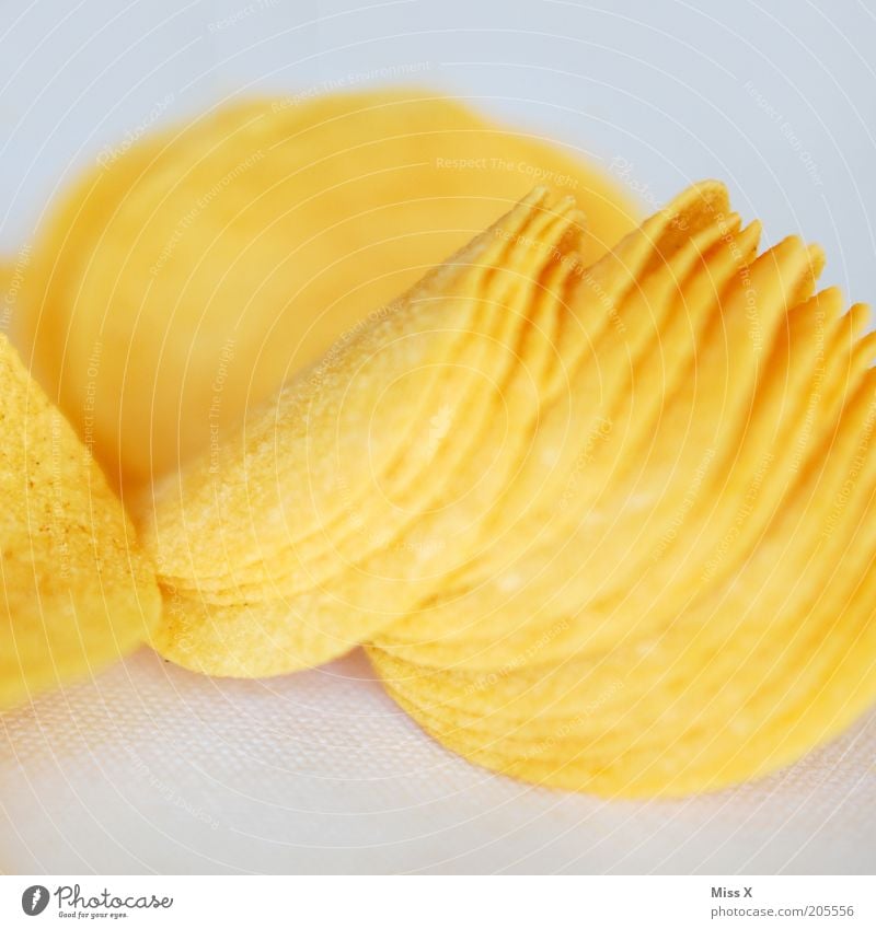 chips Food Nutrition Fast food Finger food Delicious Dry Yellow Gold Appetite Crisps Nibbles Salty Colour photo Studio shot Close-up Shallow depth of field