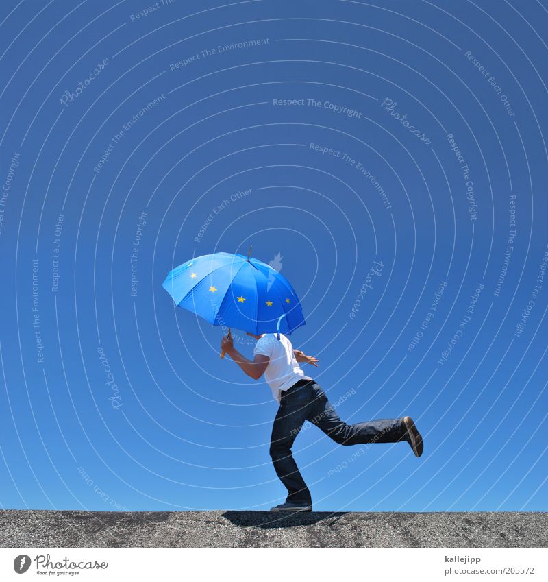 european balancing act Success Human being Masculine Man Adults 1 Movement Contentment Europe European flag Umbrella Balance Stability Safety Colour photo