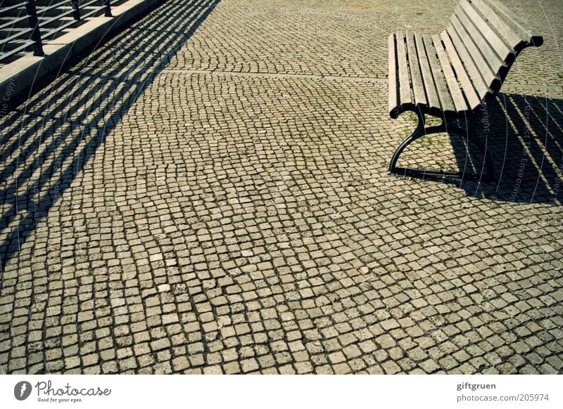heat holiday Places Bench Seating Park bench Wooden bench Handrail Cobblestones Shadow play Building line Empty Summer Beautiful weather Free Pavement Furniture