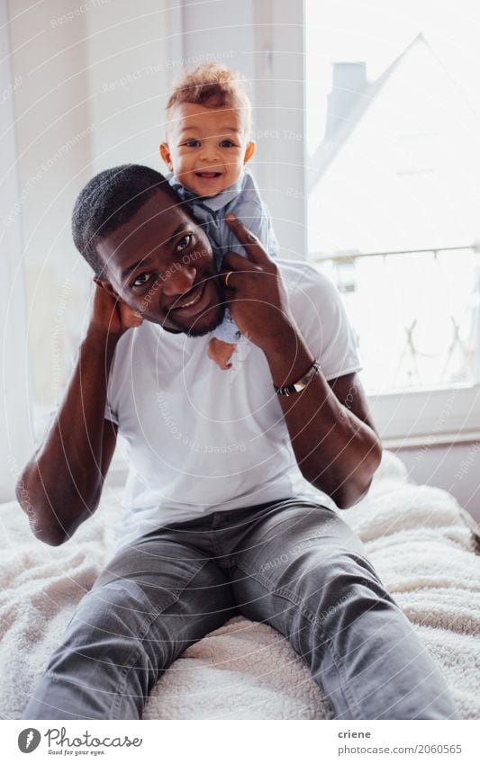 Portrait of African Father and toddler son Lifestyle Joy Living or residing Bedroom Masculine Baby Toddler Boy (child) Young man Youth (Young adults) Adults