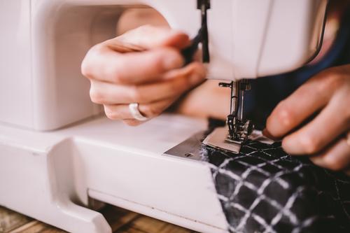 Close-up of woman sewing with sewing machine Lifestyle Handcrafts Work and employment Profession Workplace Services Business SME Career Sewing machine Feminine