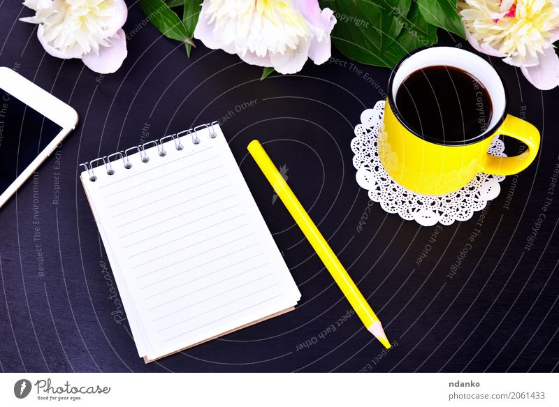 Empty notebook and yellow cup To have a coffee Drinking Hot drink Coffee Cup Telephone PDA Flower Study Bright Yellow Pink Black White Pencil background Peony