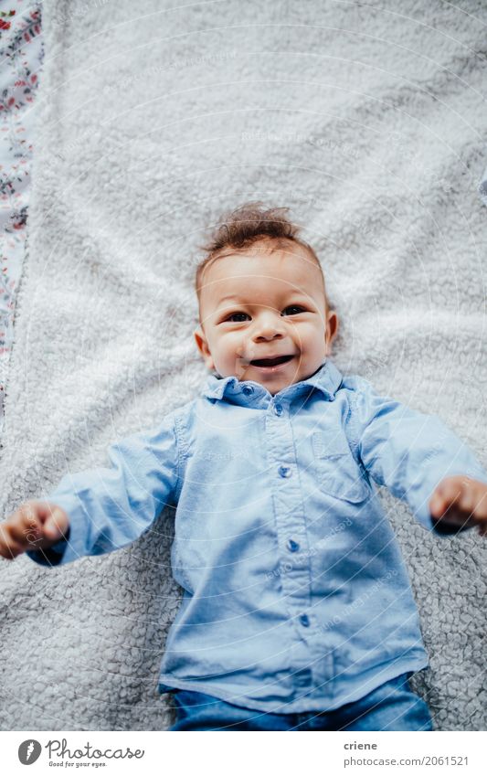 Portrait of smiling male toddler in bed Lifestyle Joy Happy Well-being Bed Children's room Bedroom Human being Masculine Toddler Boy (child) 1 Smiling Lie Small