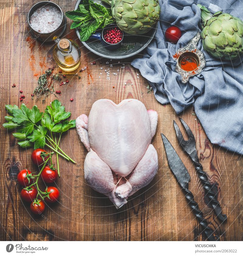 Whole chicken with vegetables and ingredients on kitchen table Food Meat Vegetable Herbs and spices Cooking oil Nutrition Lunch Dinner Banquet Organic produce