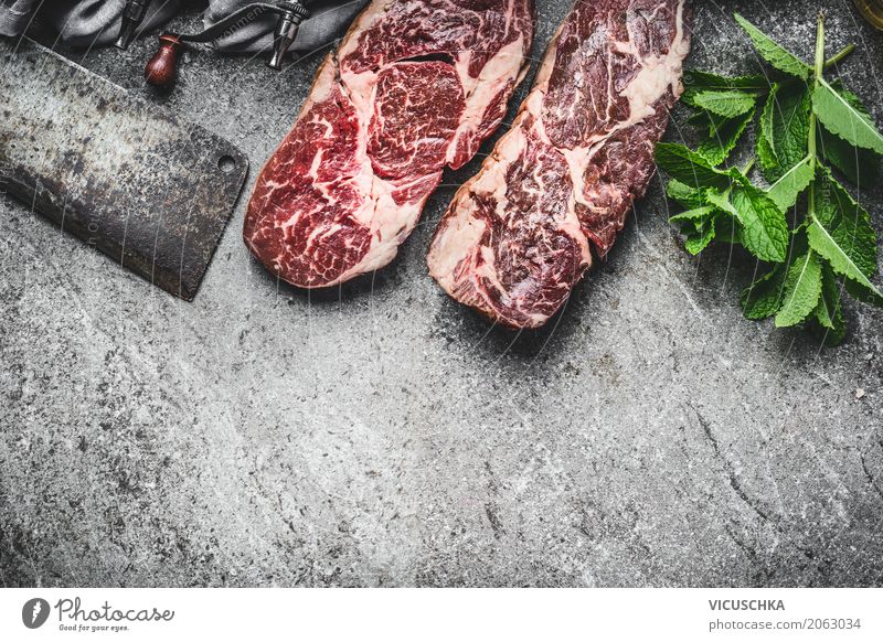 Steaks with meat knife and fresh kitchen herbs Food Meat Herbs and spices Nutrition Knives Style Design Table Kitchen Restaurant Barbecue (apparatus)