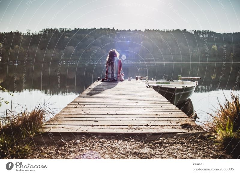 Woman sitting on a jetty by a lake in the morning Coffee Lifestyle Style Harmonious Well-being Contentment Senses Relaxation Calm Leisure and hobbies