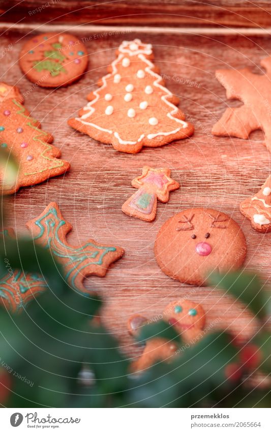 Christmas cookies decorated with frosting on wooden board Food Candy Decoration Table Feasts & Celebrations Christmas & Advent Wood Make Tradition Baking