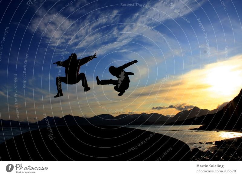 Fun in the Midnight Sun Sports Martial arts Landscape Mountain Lofotes Movement Flying Jump Esthetic Exceptional Cool (slang) Free Together Beautiful Crazy Blue