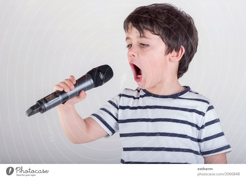 Boy singing to microphone Lifestyle Leisure and hobbies Human being Masculine Child Toddler Boy (child) Infancy 1 3 - 8 years Event Shows Party Music Concert