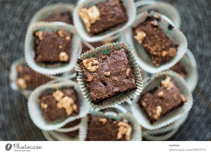 Chocolate cake for everyone Dough Baked goods Cake Dessert brownie Caramel Sugar Etagere cute Brown muffin tin Sharp-edged Muffin Shallow depth of field