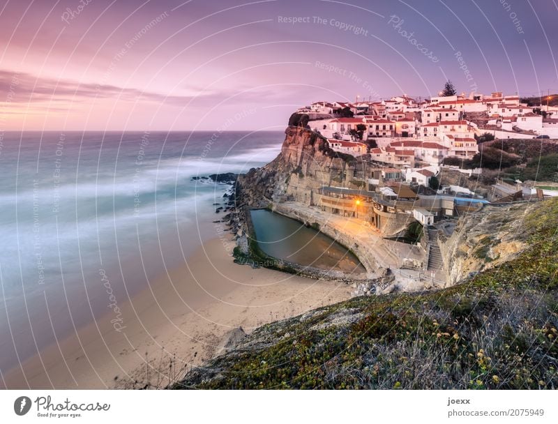 Idyllic situated village at steep coast with tidal swimming pool, long time exposure Ocean Maritime Village Beach Portugal Pink tidal pool evening mood