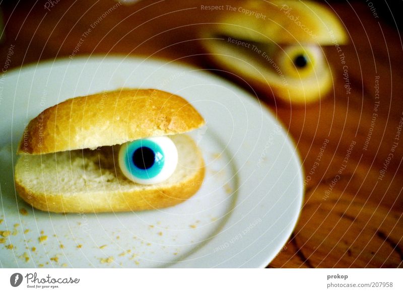 Breakfast with Bill Food Dough Baked goods Plate Eyes Observe Roll Crumbs Table Pupil Bizarre Surrealism Looking Foreign Threat Whimsical Colour photo