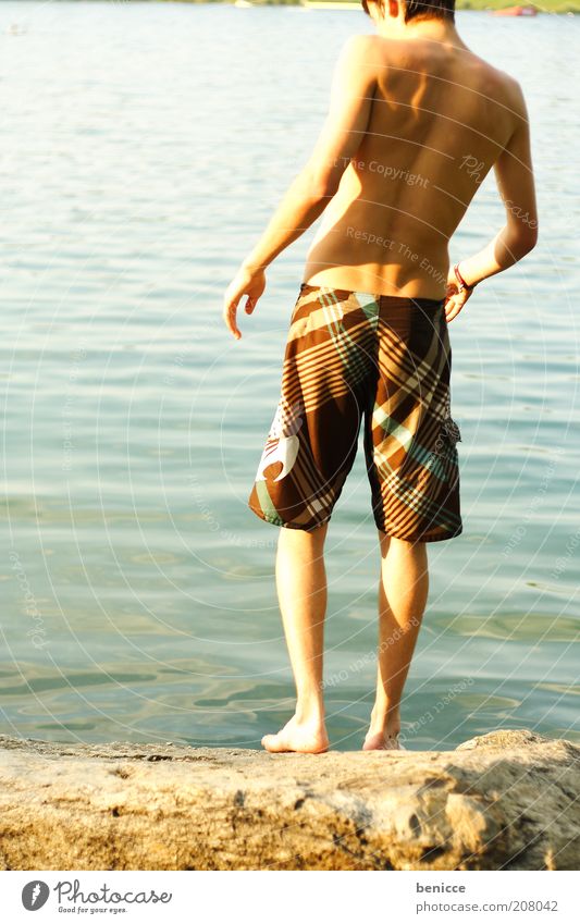 At the lake Human being Youth (Young adults) Lake Pond Swimming lake Twilight Summer Swimming trunks Observe Looking Stand Swimming & Bathing Vacation & Travel