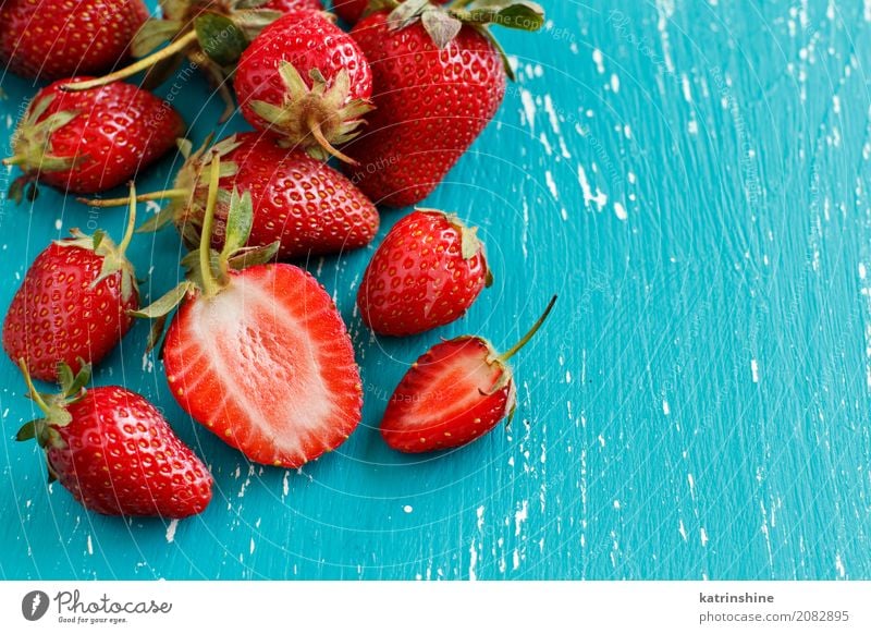 Strawberries on a turquoise blue old wooden table Vegetable Dessert Diet Summer Table Group Wood Fresh Bright Delicious Natural Juicy Blue Red Turquoise Colour
