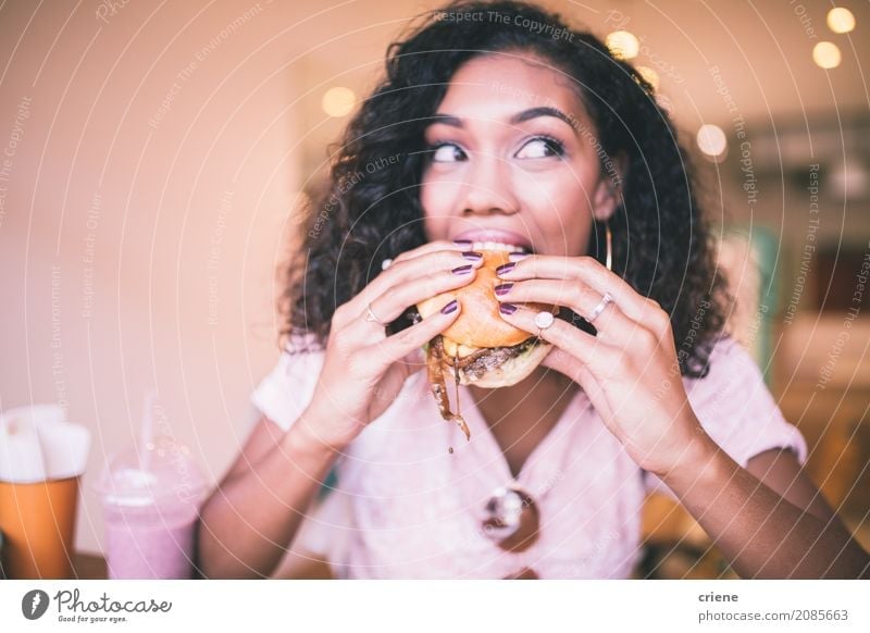 Woman taking bite of hamburger in restaurant Food Eating Diet Fast food Lifestyle Restaurant Human being Feminine Young woman Youth (Young adults) Adults 1