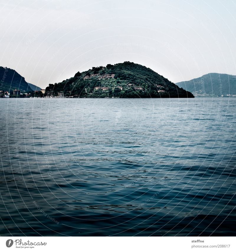 Even more mature for the island Nature Landscape Water Cloudless sky Waves Coast Lakeside Island Italy Esthetic Blue Lago d'Iseo Colour photo Subdued colour
