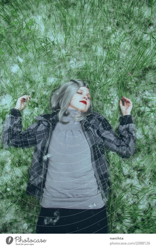 Young woman lying down over a field of grass and pollen Human being Feminine Youth (Young adults) 1 18 - 30 years Adults Environment Nature Spring Grass Pollen