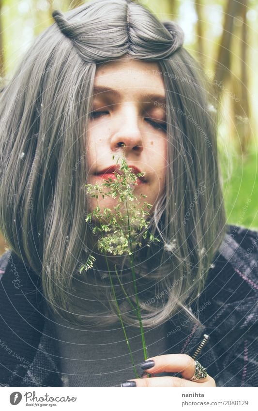 Young woman with gray hair is smelling flowers Lifestyle Elegant Beautiful Healthy Allergy Wellness Harmonious Human being Feminine Youth (Young adults) 1