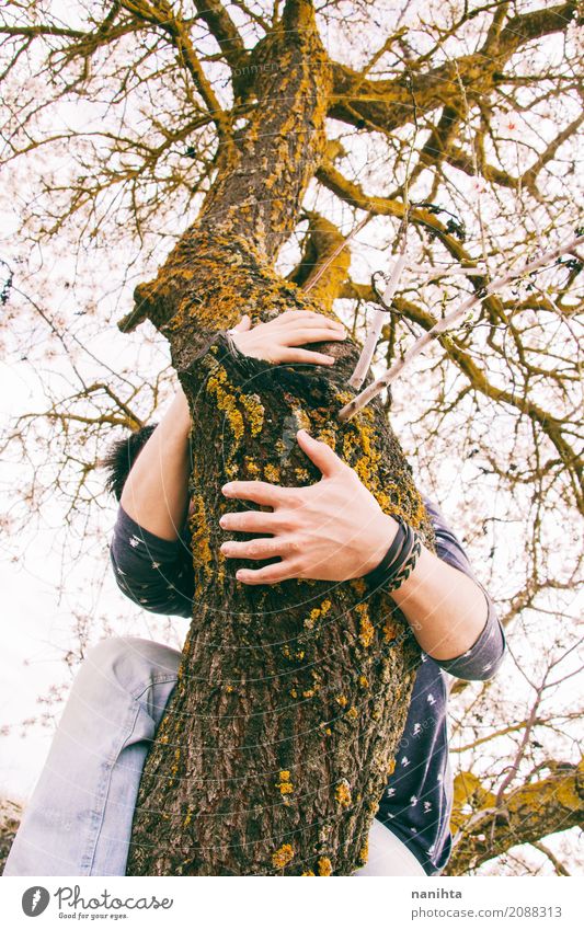 Young man hugging a tree Lifestyle Human being Masculine Youth (Young adults) 1 18 - 30 years Adults Environment Nature Sky Plant Tree Park Forest Breathe