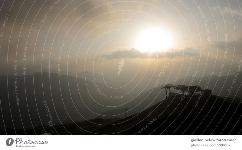 Sunrise in the Alps Mountain Peak Cable car Ski lift Brown Yellow Gold Wanderlust Colour photo Subdued colour Exterior shot Deserted Morning Dawn Silhouette