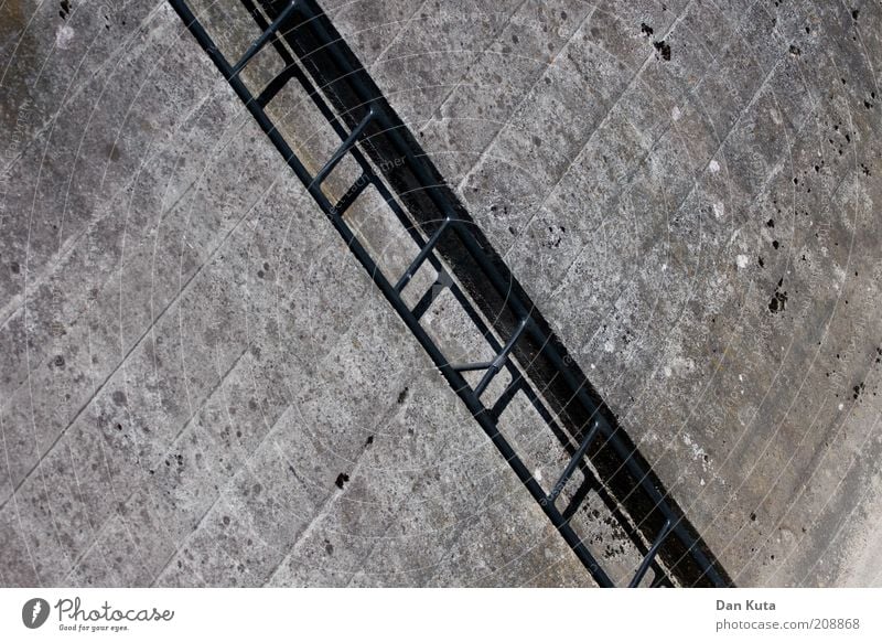 An eternal up and down ... Building Concrete Metal Stairs Ladder Dirty Sharp-edged Tall Gloomy Gray Level Upward Downward Ascending Rising Graphic Exterior shot