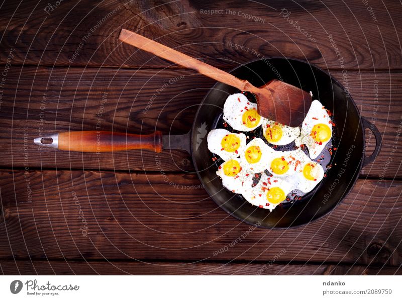 Fried quail eggs Meat Herbs and spices Eating Breakfast Pan Spoon Table Kitchen Wood Natural Above Retro Brown Egg Yolk Protein frying pan Frying food cook