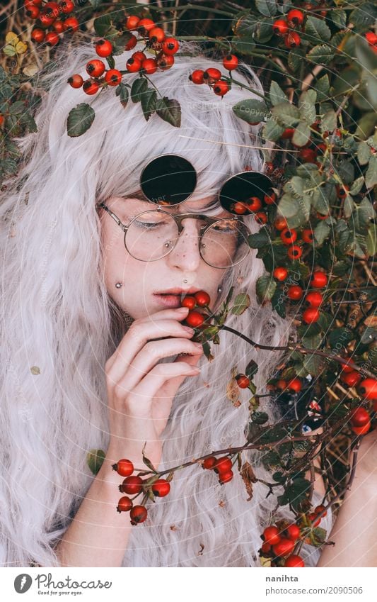 Young woman eating wild berries Food Vegetable Fruit Berries Eating Human being Feminine Youth (Young adults) 1 18 - 30 years Adults Nature Plant Autumn Bushes