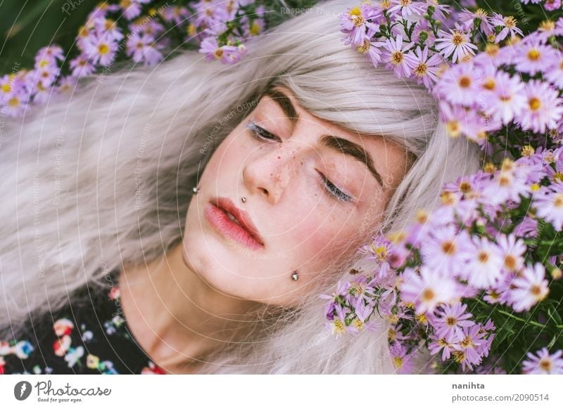Young woman posing with purple flowers Elegant Face Freckles Senses Relaxation Fragrance Human being Feminine Youth (Young adults) 1 18 - 30 years Adults